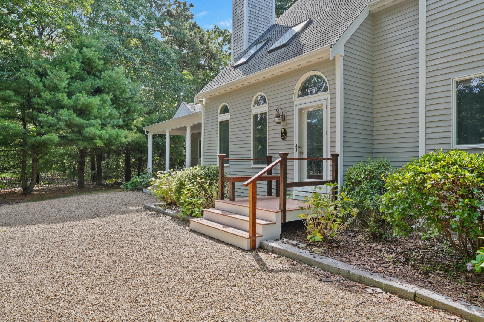 12 Duarte Circle Edgartown, MA 02539 - Photo 3 of 43 a front view of a house with garden
