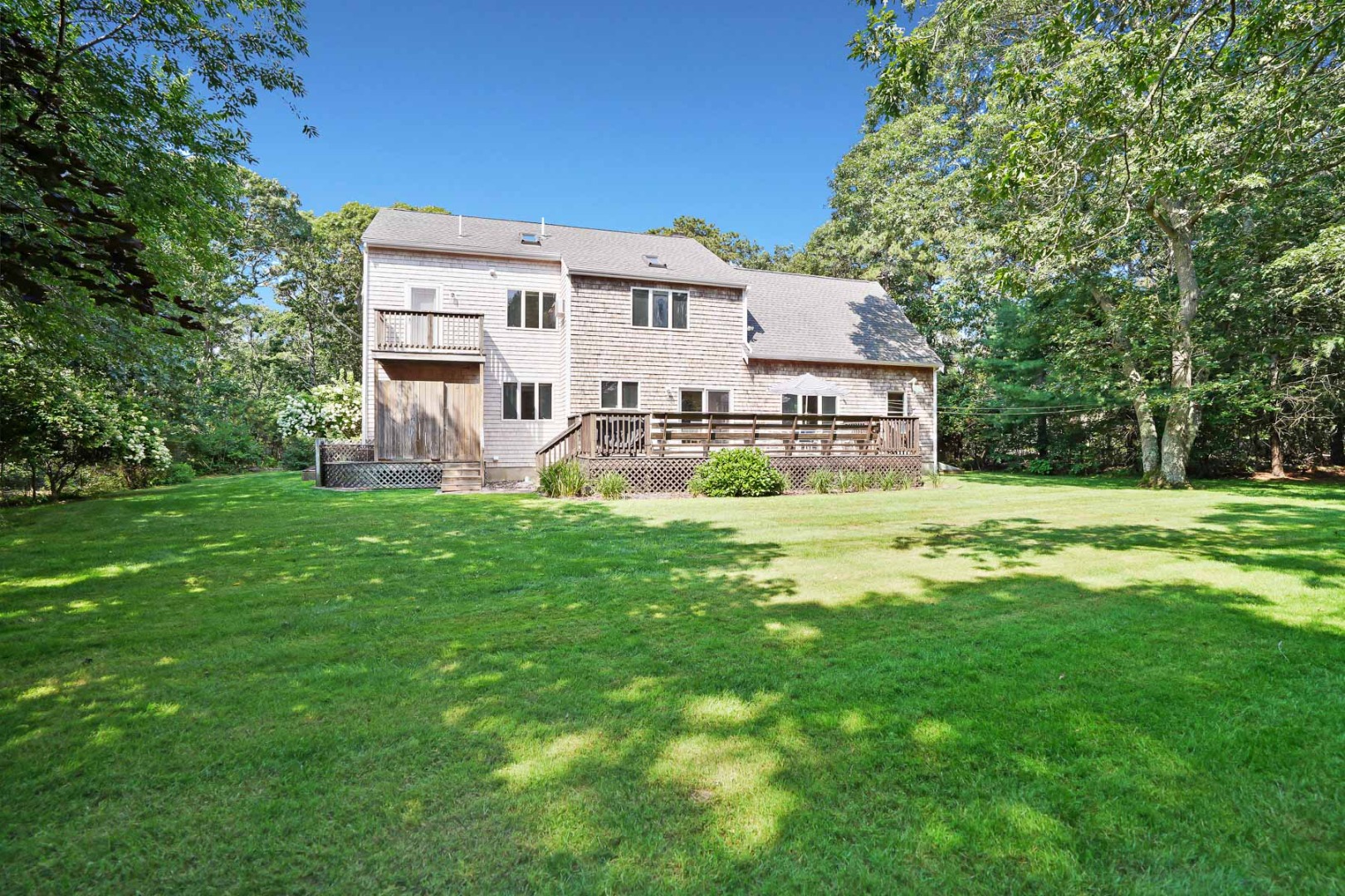 12 Duarte Circle Edgartown, MA 02539 - Photo 35 of 43 a house view with swimming pool in front of it