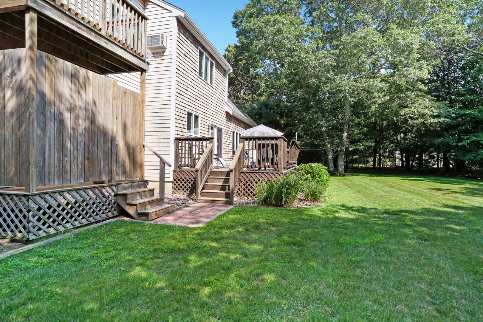12 Duarte Circle Edgartown, MA 02539 - Photo 6 of 43 a view of a house with a yard and sitting area
