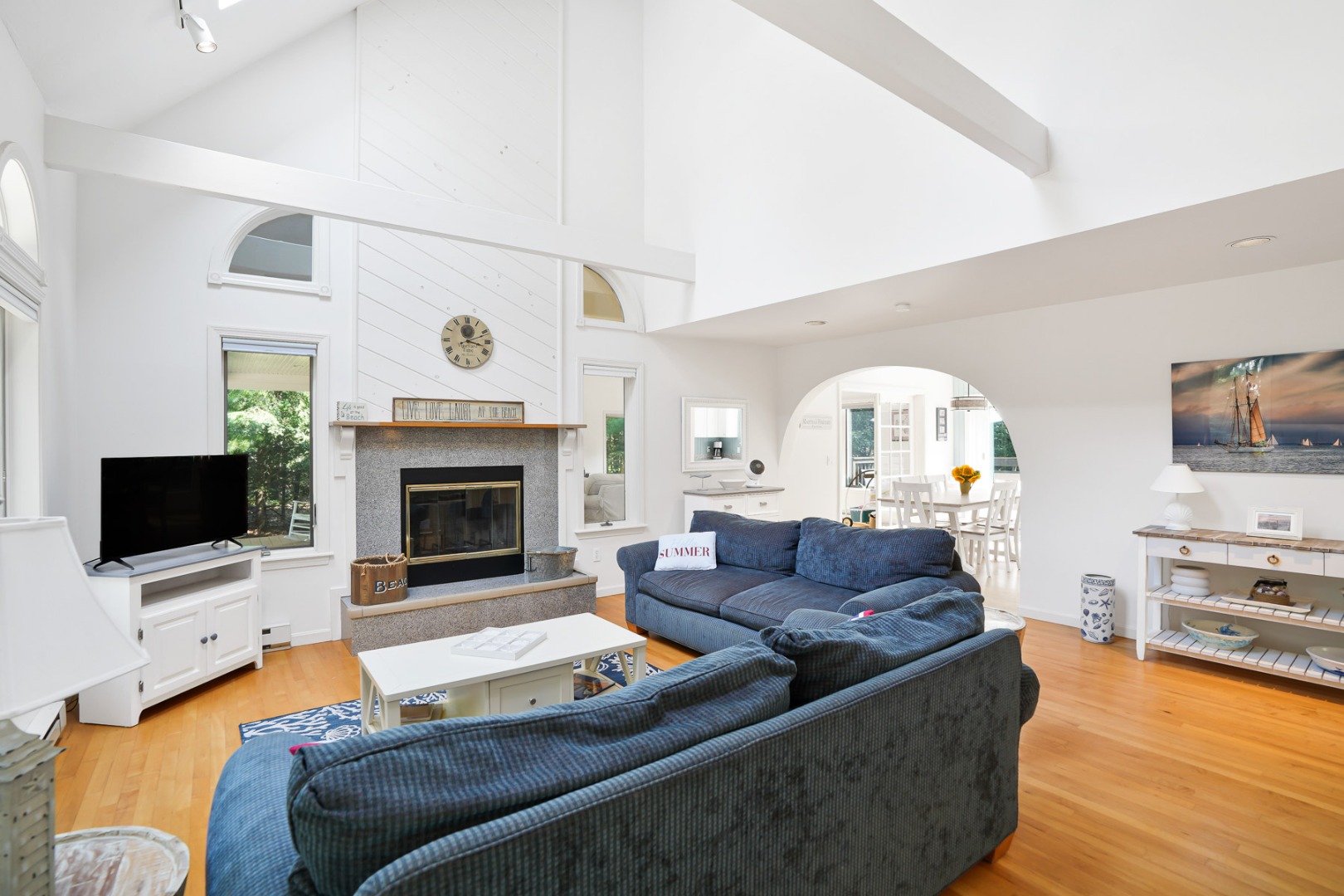 12 Duarte Circle Edgartown, MA 02539 - Photo 9 of 43 a living room with furniture flat screen tv and a fireplace