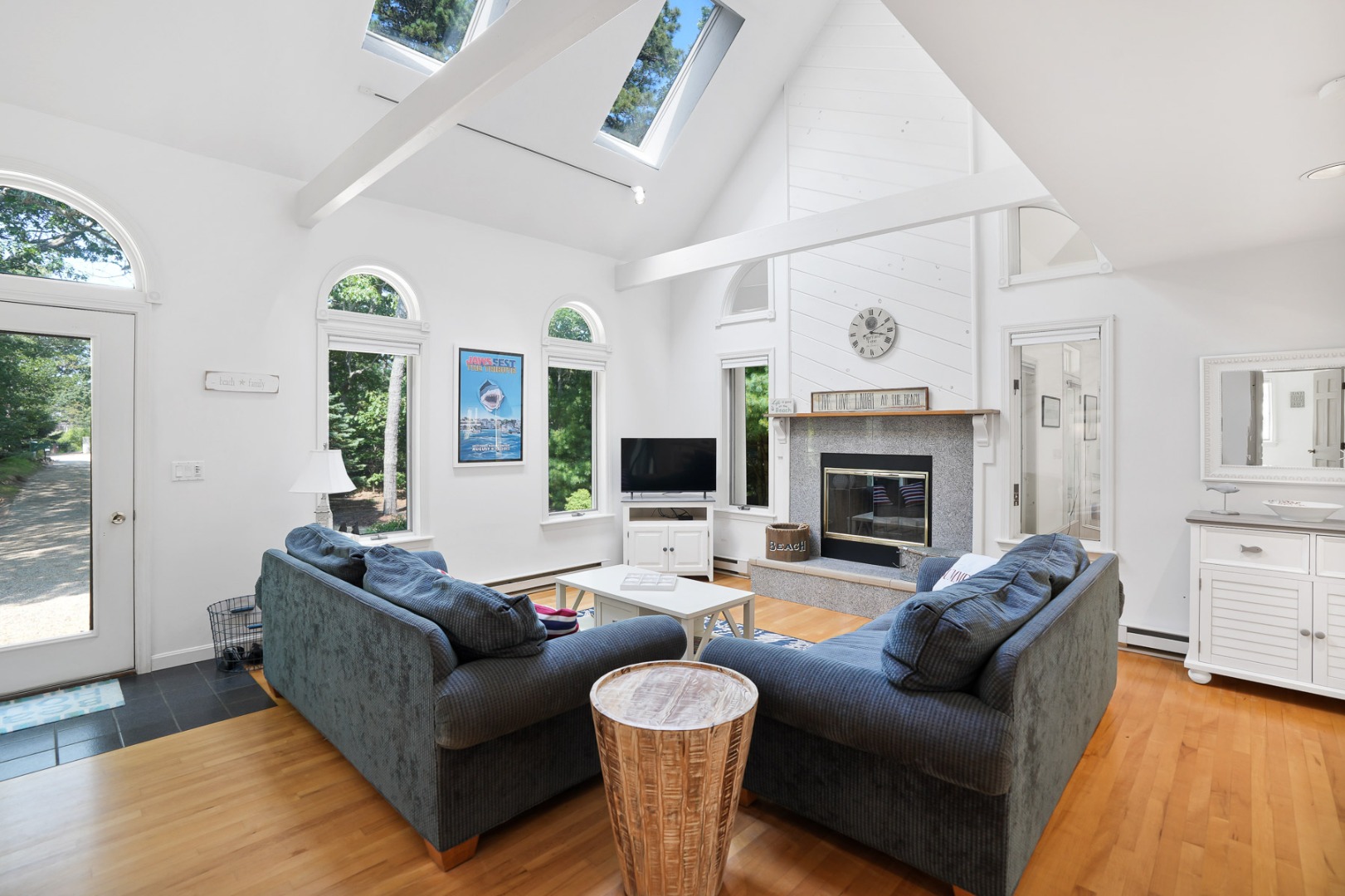12 Duarte Circle Edgartown, MA 02539 - Photo 10 of 43 a living room with furniture a fireplace and a large mirror