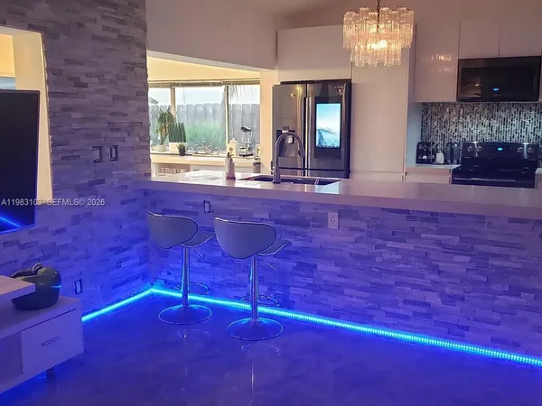 a living room with a couch and a window