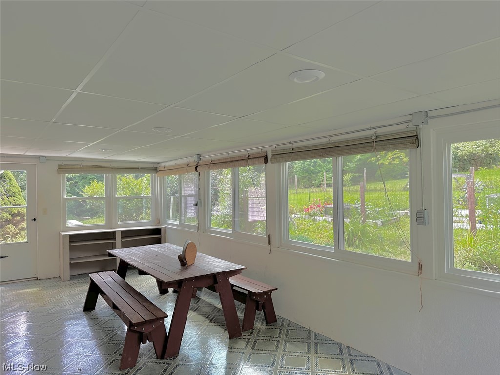 1009 Sandy Lake Road Kent, OH 44240 - Photo 25 of 35 Huge back porch with plenty of light and two side door to backyard