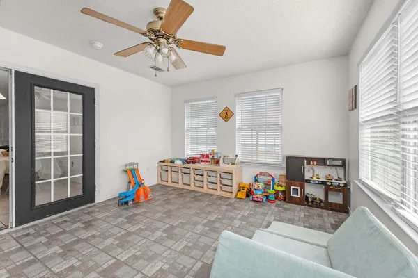 a living room with furniture and a window