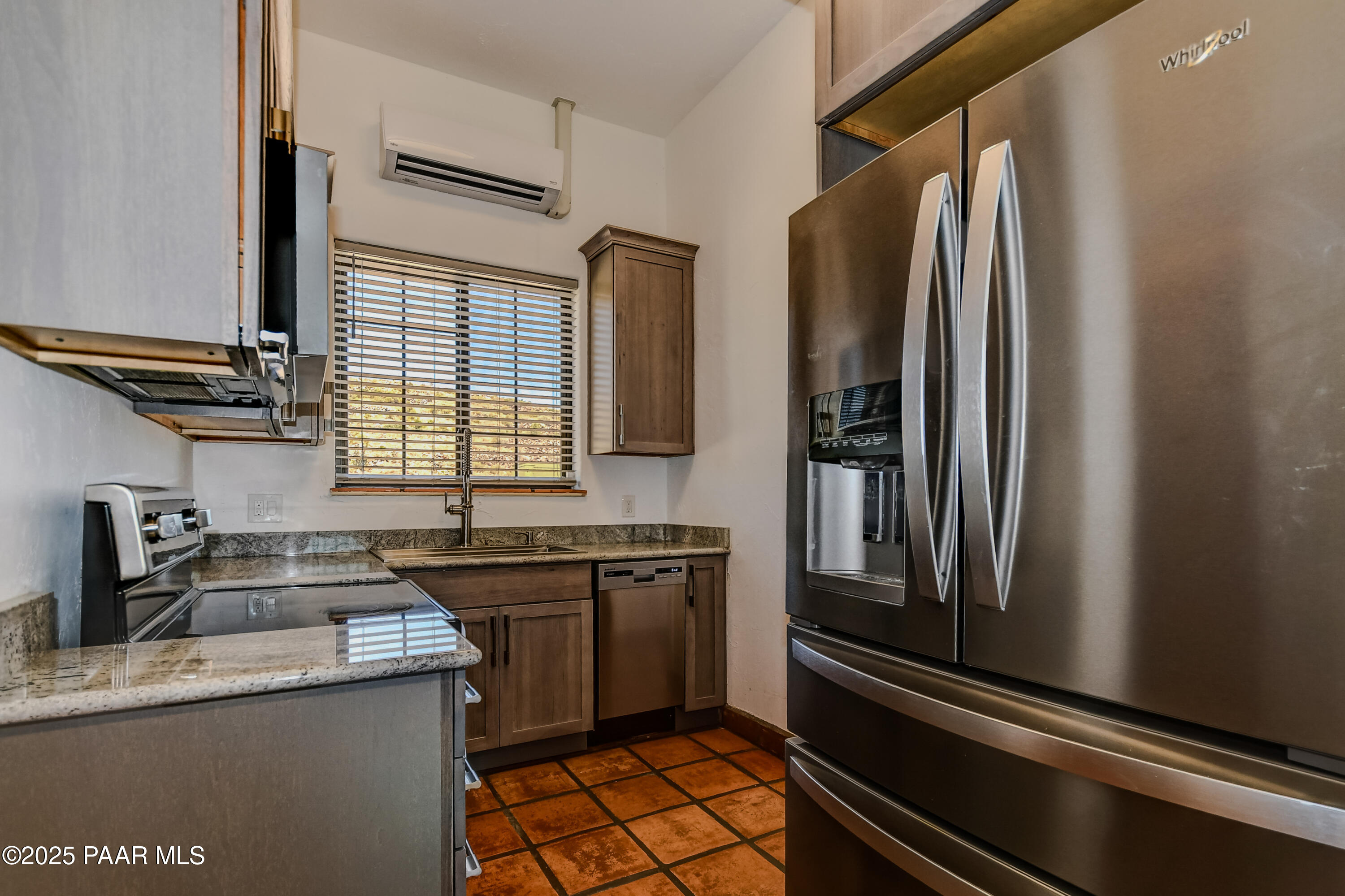 3200 West Rugged Spirit Trail Prescott, AZ 86305 - Photo 18 of 48 a kitchen with stainless steel appliances granite countertop a sink stove and refrigerator
