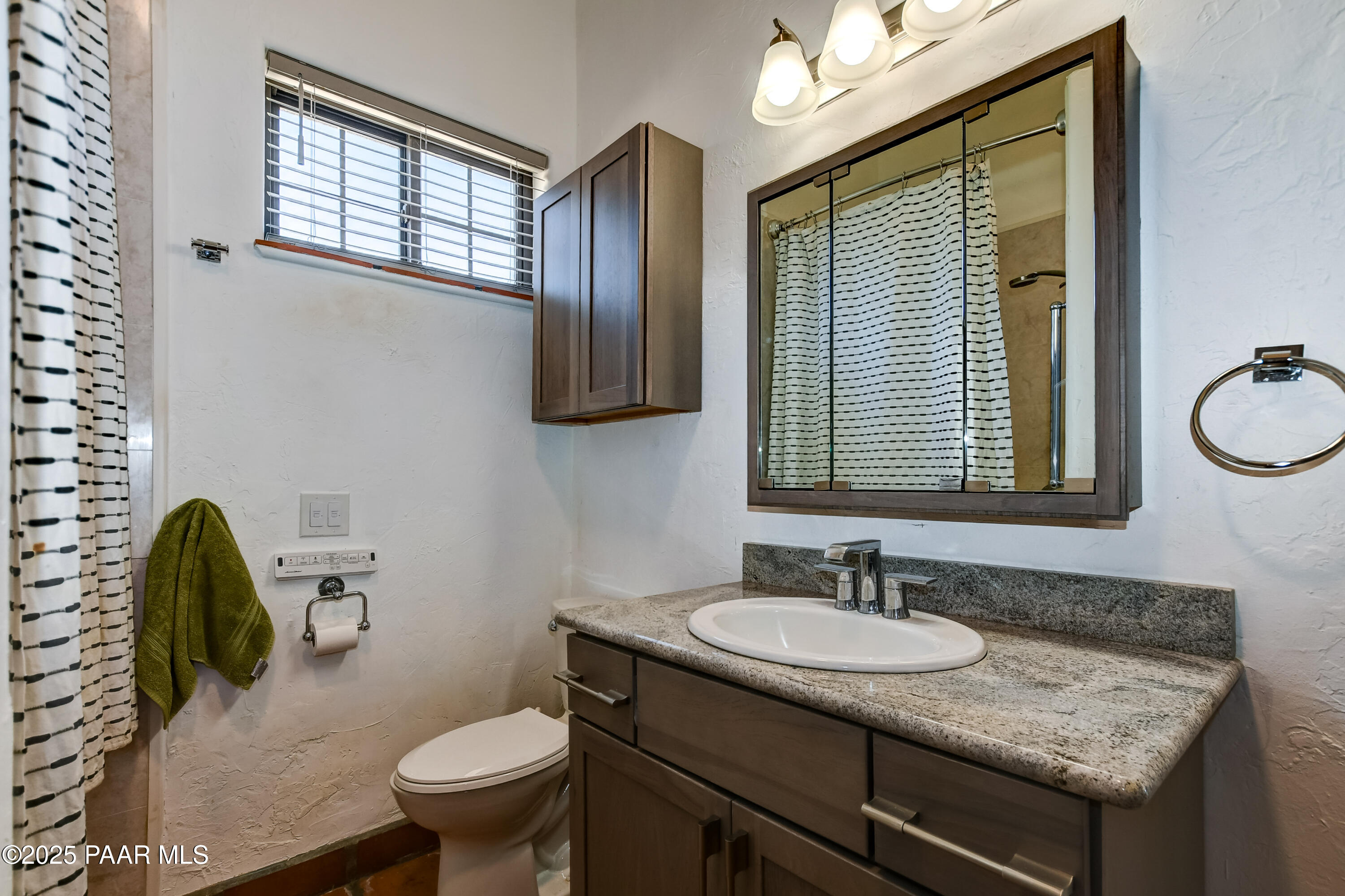 3200 West Rugged Spirit Trail Prescott, AZ 86305 - Photo 21 of 48 a bathroom with a granite countertop sink toilet and mirror