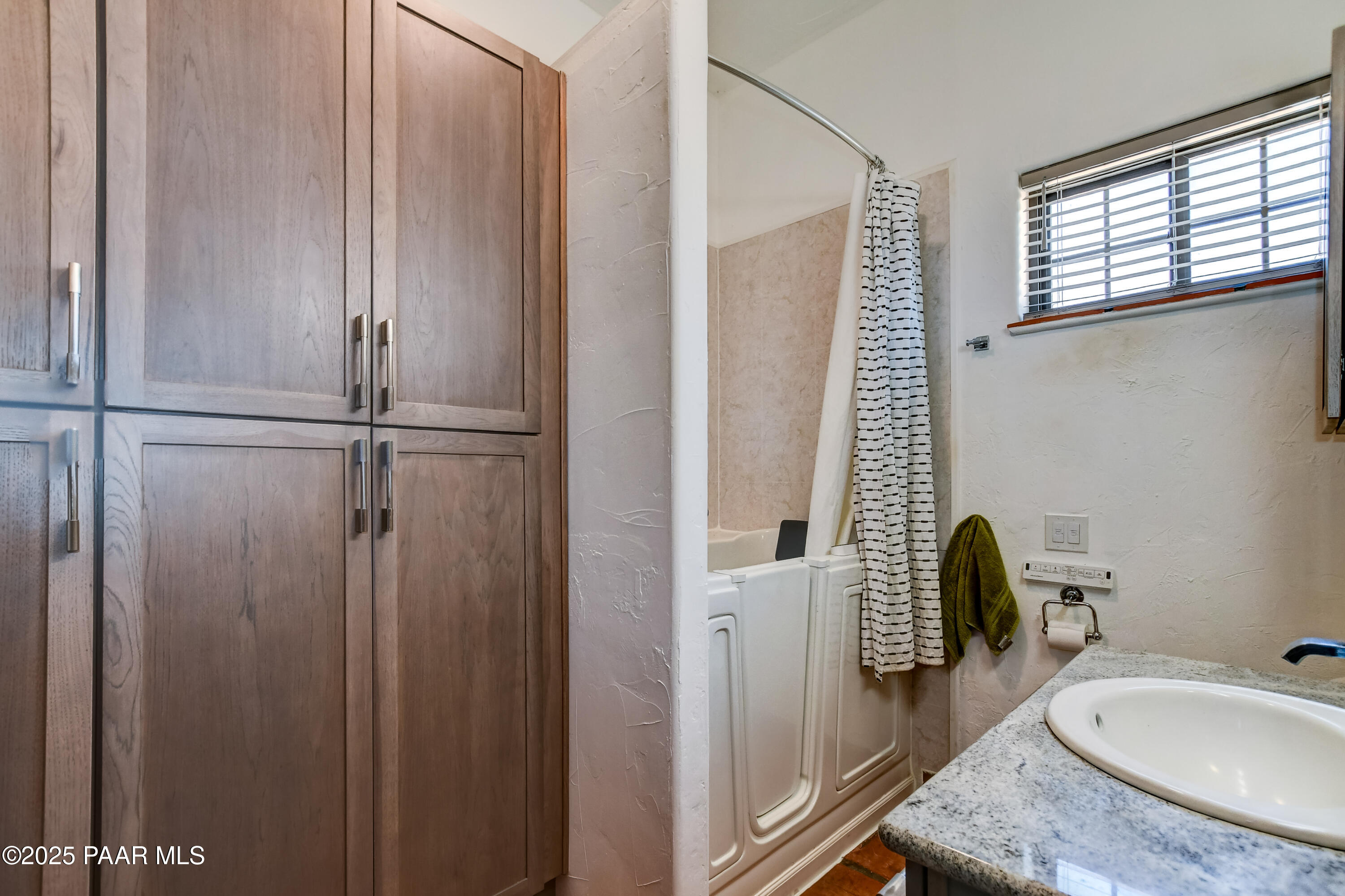 3200 West Rugged Spirit Trail Prescott, AZ 86305 - Photo 22 of 48 a bathroom with a granite countertop sink and a mirror
