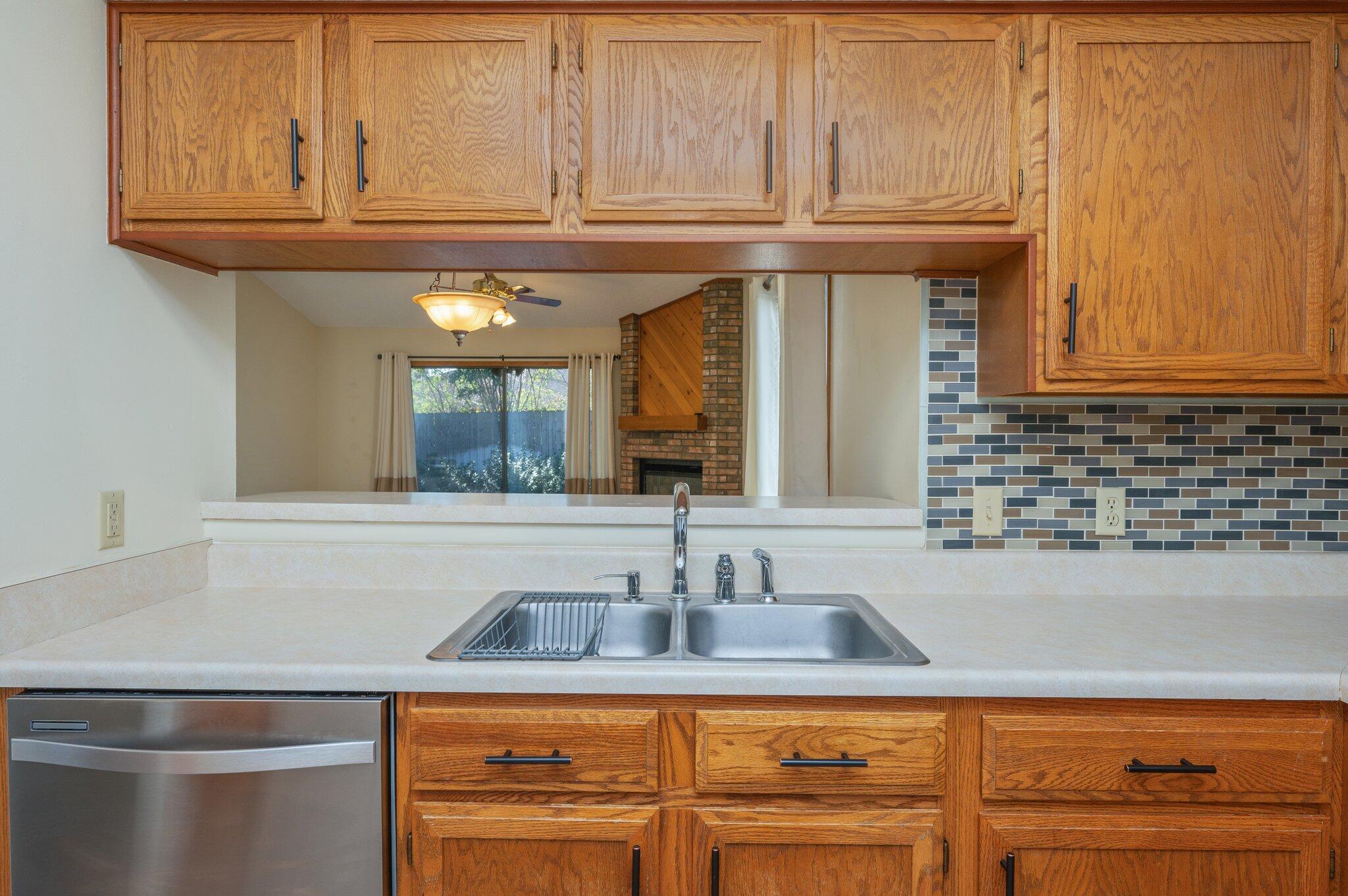 101 Cedar Ridge Way Niceville, FL 32578 - Photo 12 of 33 a kitchen with stainless steel appliances granite countertop a sink and cabinets