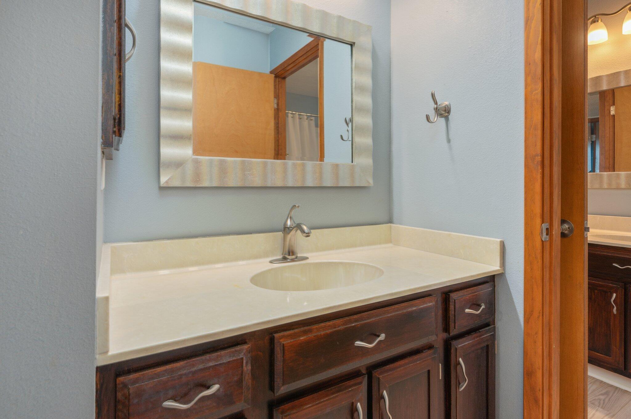 101 Cedar Ridge Way Niceville, FL 32578 - Photo 19 of 33 a bathroom with a sink and a mirror