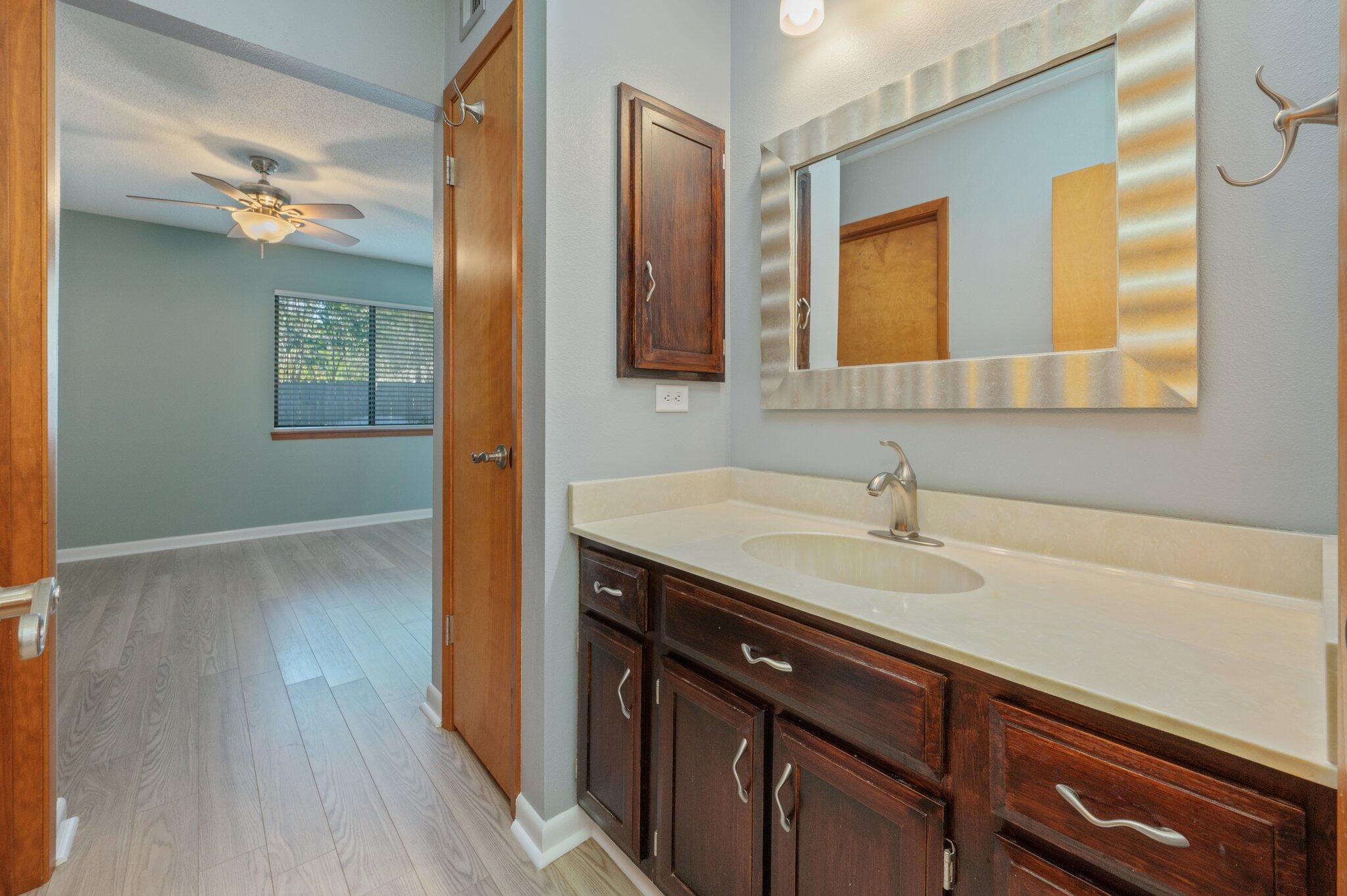 101 Cedar Ridge Way Niceville, FL 32578 - Photo 24 of 33 a bathroom with a sink and a mirror