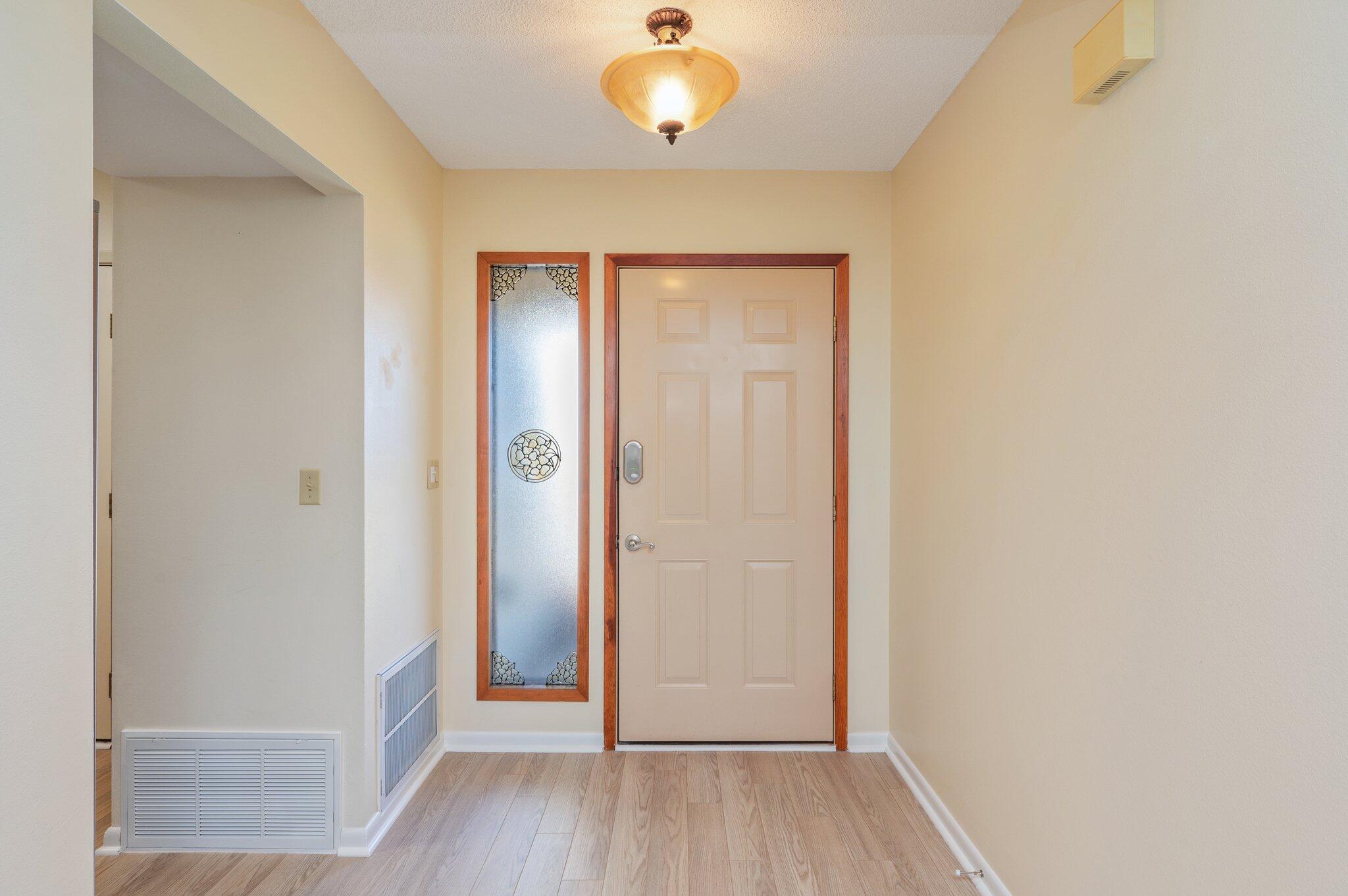 101 Cedar Ridge Way Niceville, FL 32578 - Photo 5 of 33 an entryway to room with wooden floor