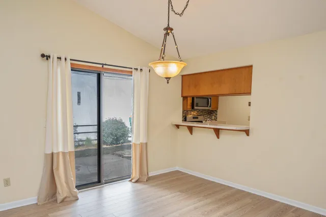 a view of a storage & utility room with wooden floor