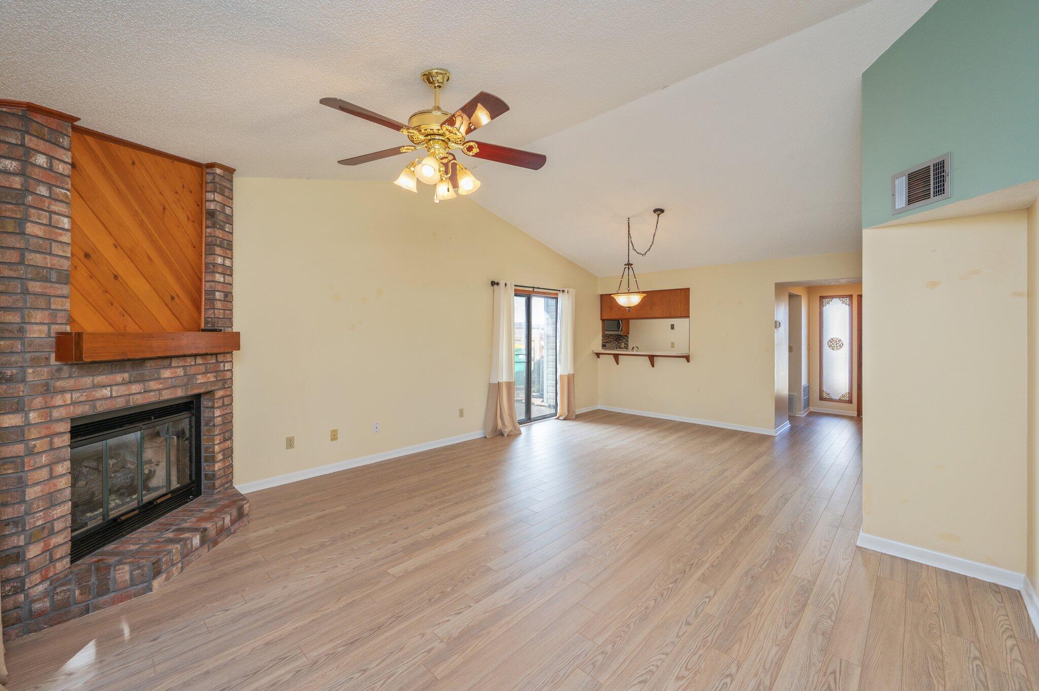 101 Cedar Ridge Way Niceville, FL 32578 - Photo 9 of 33 a view of an empty room with chandelier and fireplace