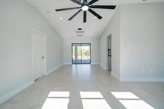 a view of an empty room with a window