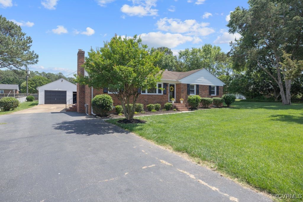 3511 Respess Road Midlothian, VA 23112 - Photo 3 of 40 a front view of a house with garden
