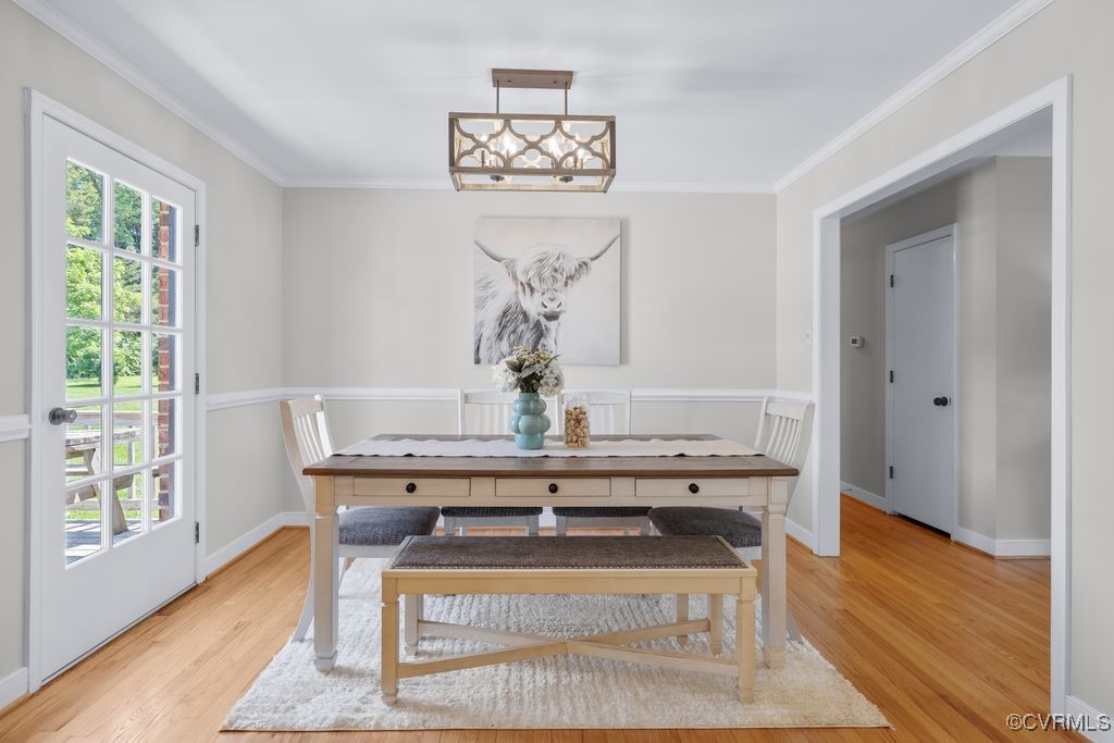 3511 Respess Road Midlothian, VA 23112 - Photo 9 of 40 a view of a hallway with wooden floor and a chandelier