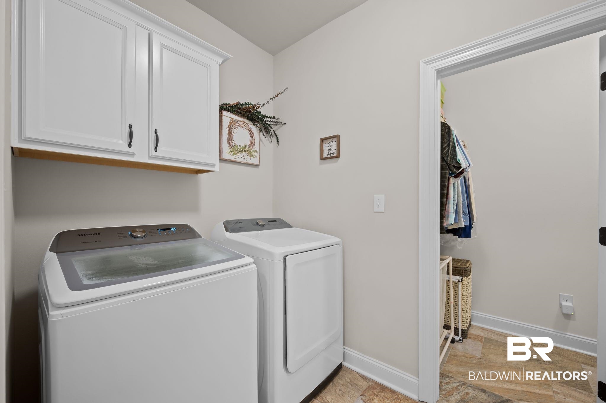 33842 Rutland Lane Spanish Fort, AL 36527 - Photo 33 of 42 Laundry area featuring independent washer and dryer, baseboards, and cabinet space