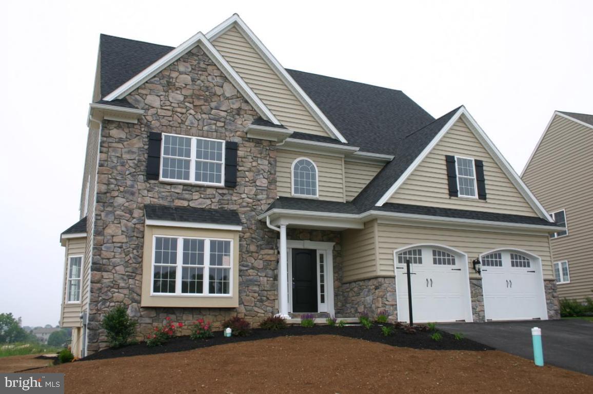 339 Spurrier Drive, Unit 46 Lititz, PA 17543 - Photo 1 of 1 a front view of a house with a yard