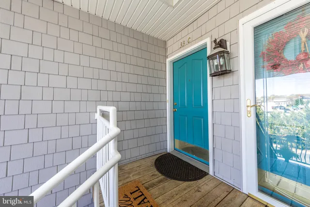 a view of a balcony with wooden floor