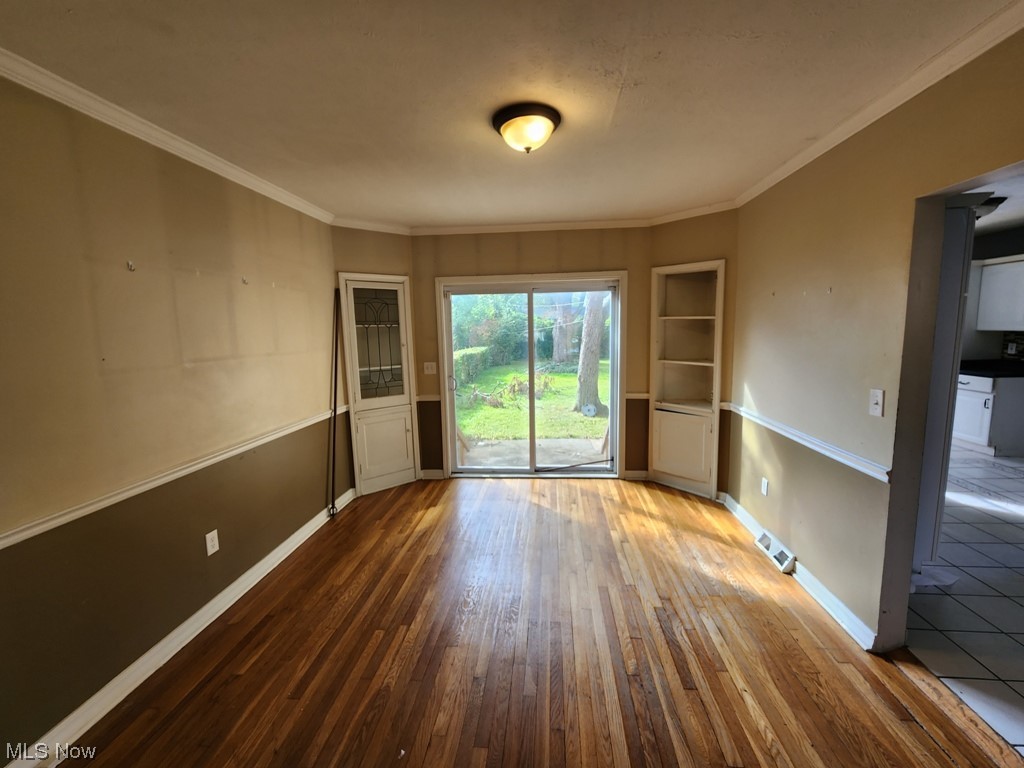 3602 Silsby Road University Heights, OH 44118 - Photo 6 of 19 Tiled spare room featuring crown molding