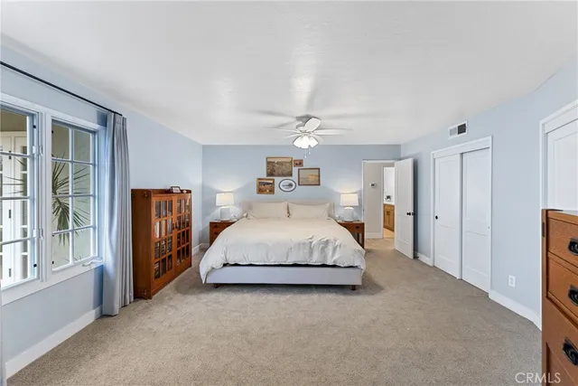 a spacious bathroom with a double vanity sink and a mirror
