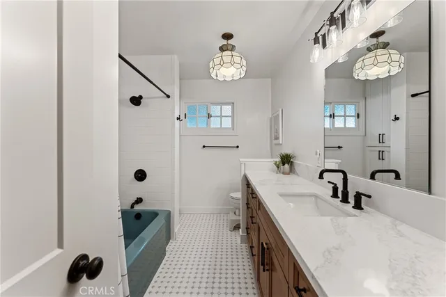 an aerial view of a house with a yard and outdoor seating