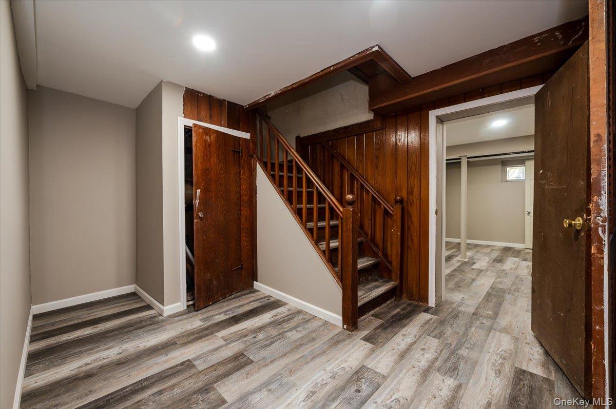 1 Parkside Drive Great Neck, NY 11021 - Photo 19 of 30 Below grade area with stairway and light wood-type flooring