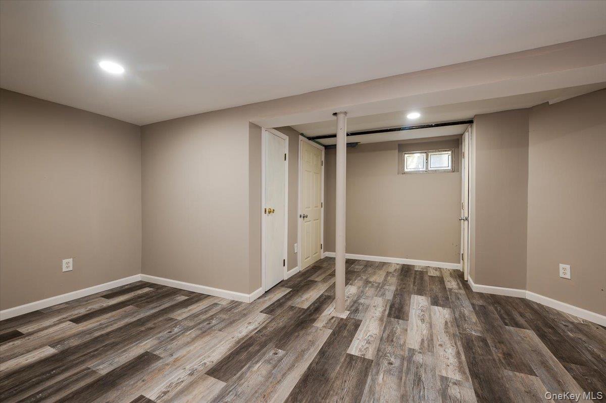 1 Parkside Drive Great Neck, NY 11021 - Photo 20 of 30 Below grade area with dark wood-style floors and recessed lighting