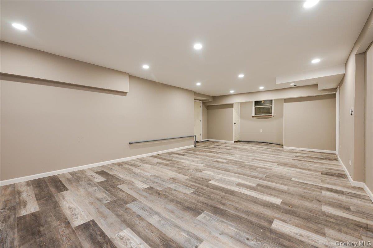 1 Parkside Drive Great Neck, NY 11021 - Photo 21 of 30 Finished basement with recessed lighting and light wood-type flooring