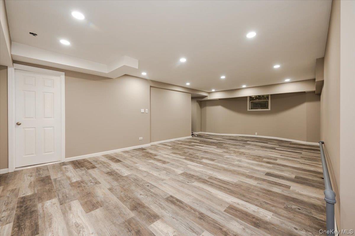 1 Parkside Drive Great Neck, NY 11021 - Photo 22 of 30 Finished basement with recessed lighting and light wood finished floors