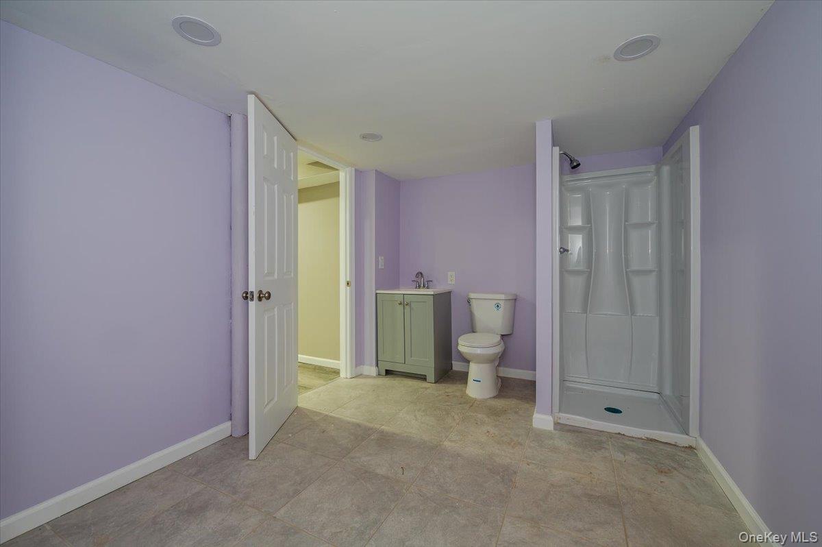 1 Parkside Drive Great Neck, NY 11021 - Photo 29 of 30 Bathroom with vanity and a shower stall