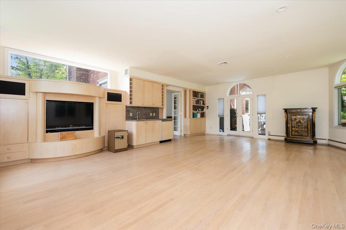 1 Parkside Drive Great Neck, NY 11021 - Photo 3 of 30 Unfurnished living room with plenty of natural light and light wood-style floors