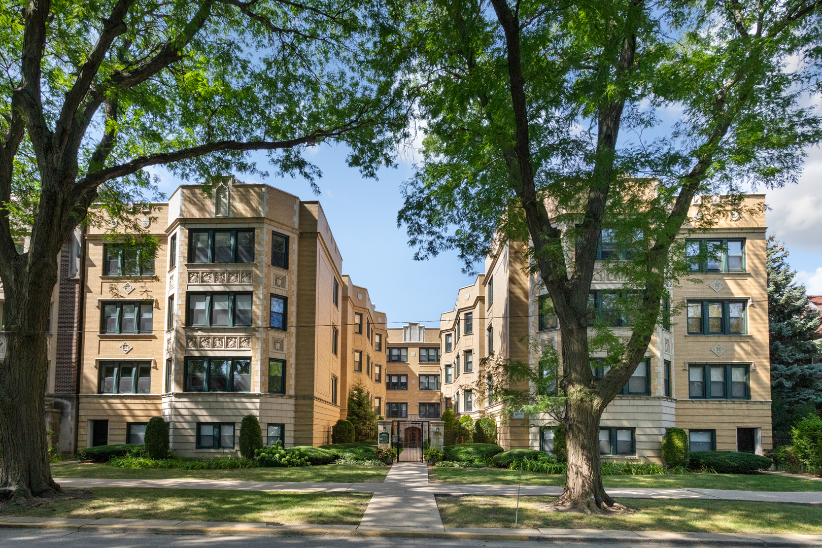 4110 North Keystone Avenue, Unit 1N Chicago, IL 60641 - Photo 1 of 15 a front view of a building with a yard