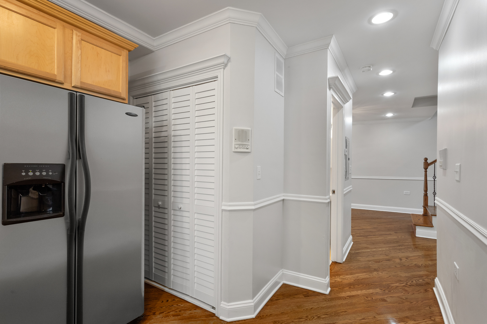 4110 North Keystone Avenue, Unit 1N Chicago, IL 60641 - Photo 5 of 15 a view of a hallway with wooden floor and staircase