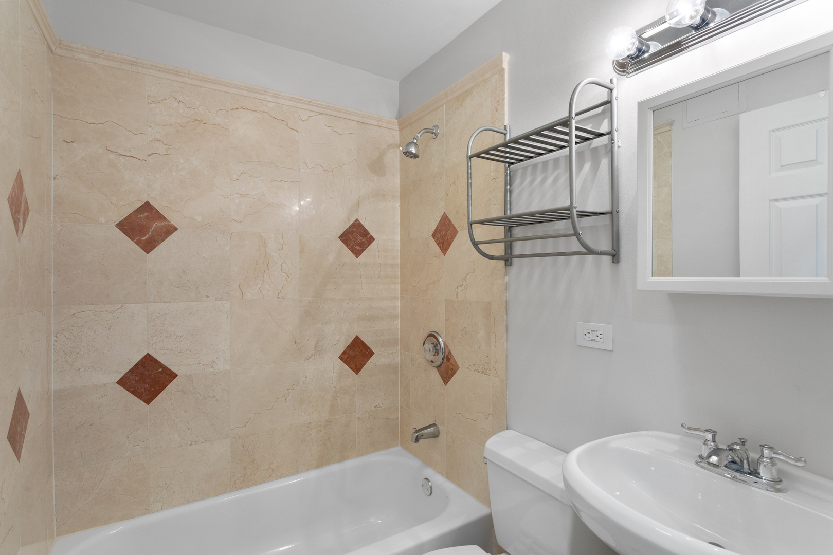 4110 North Keystone Avenue, Unit 1N Chicago, IL 60641 - Photo 8 of 15 a bathroom with a bathtub and shower