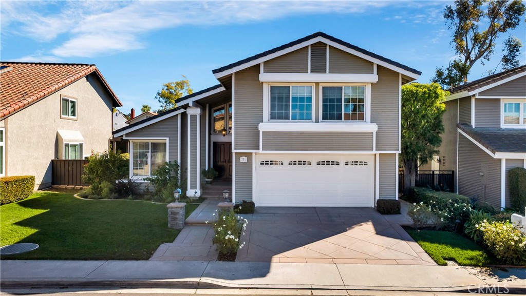 7 Nantucket Irvine, CA 92620 - Photo 2 of 55 a front view of a house with a garden