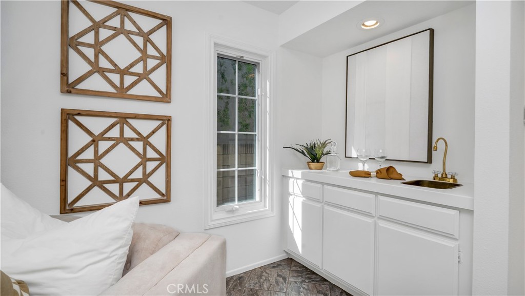 7 Nantucket Irvine, CA 92620 - Photo 27 of 55 a bathroom with a granite countertop sink a mirror and a shower