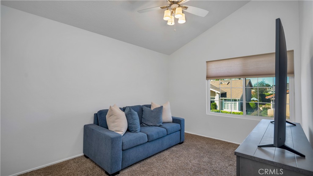 7 Nantucket Irvine, CA 92620 - Photo 31 of 55 a living room with furniture and a flat screen tv