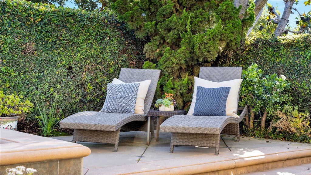 7 Nantucket Irvine, CA 92620 - Photo 52 of 55 a view of a patio with table and chairs with wooden fence and plants