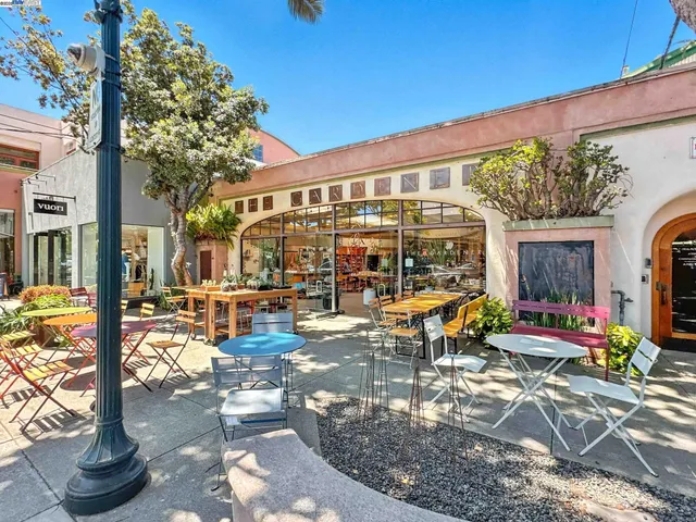 a building outdoor space with patio furniture and potted plants