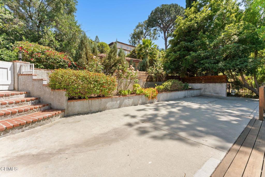 405 Woodcliffe Road Pasadena, CA 91105 - Photo 58 of 65 a view of a yard with an outdoor space