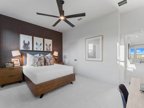 a bedroom with a bed dresser and a window