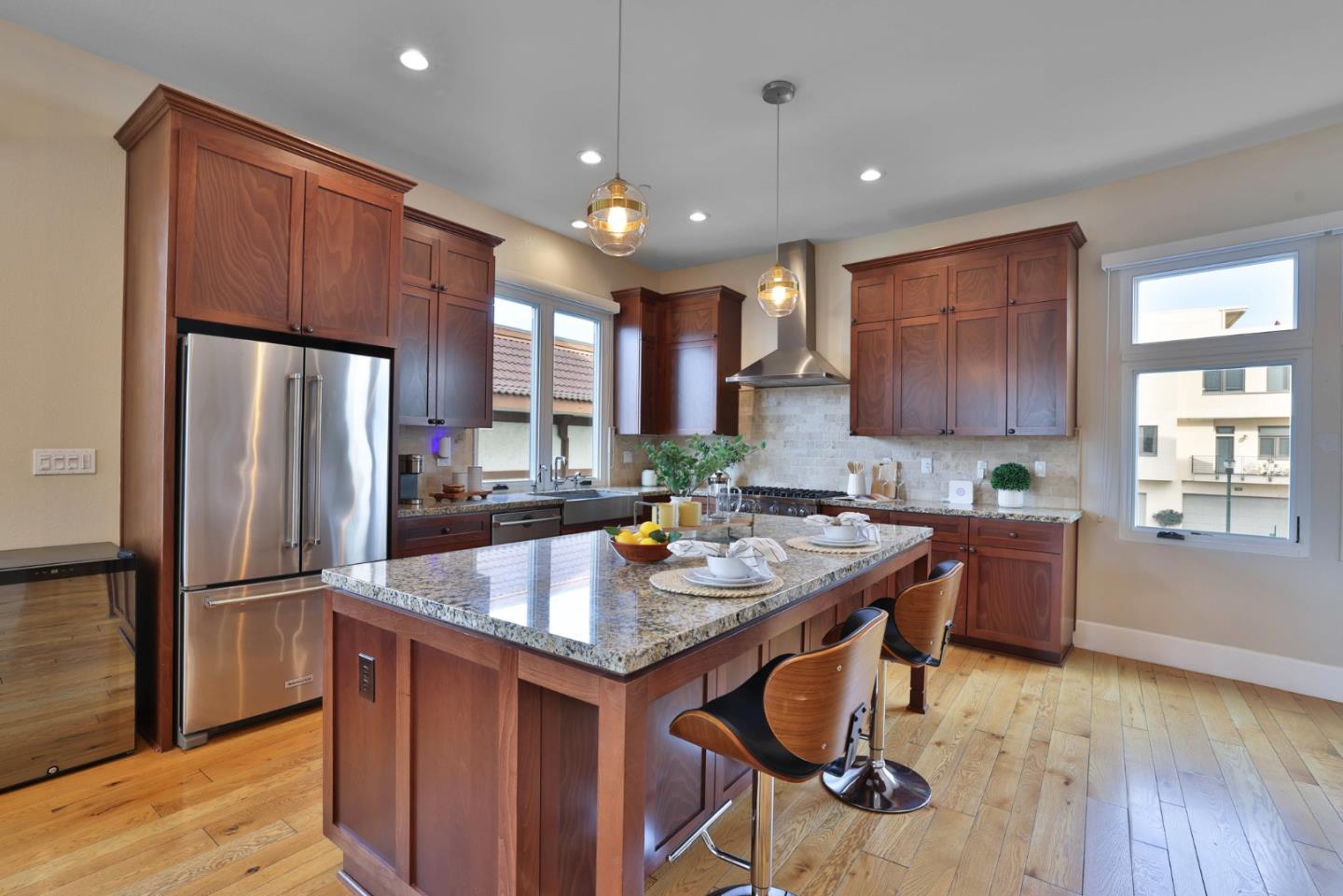 521 Fierro Loop Campbell, CA 95008 - Photo 10 of 24 a kitchen with stainless steel appliances granite countertop a refrigerator a sink dishwasher a stove and a refrigerator with wooden floor