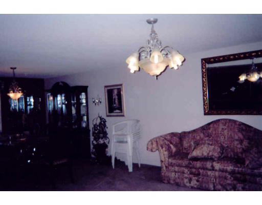 55 Gates Avenue Springfield, MA 01118 - Photo 2 of 5 a living room with furniture and chandelier