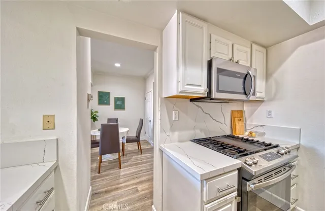 a kitchen with a stove and a microwave
