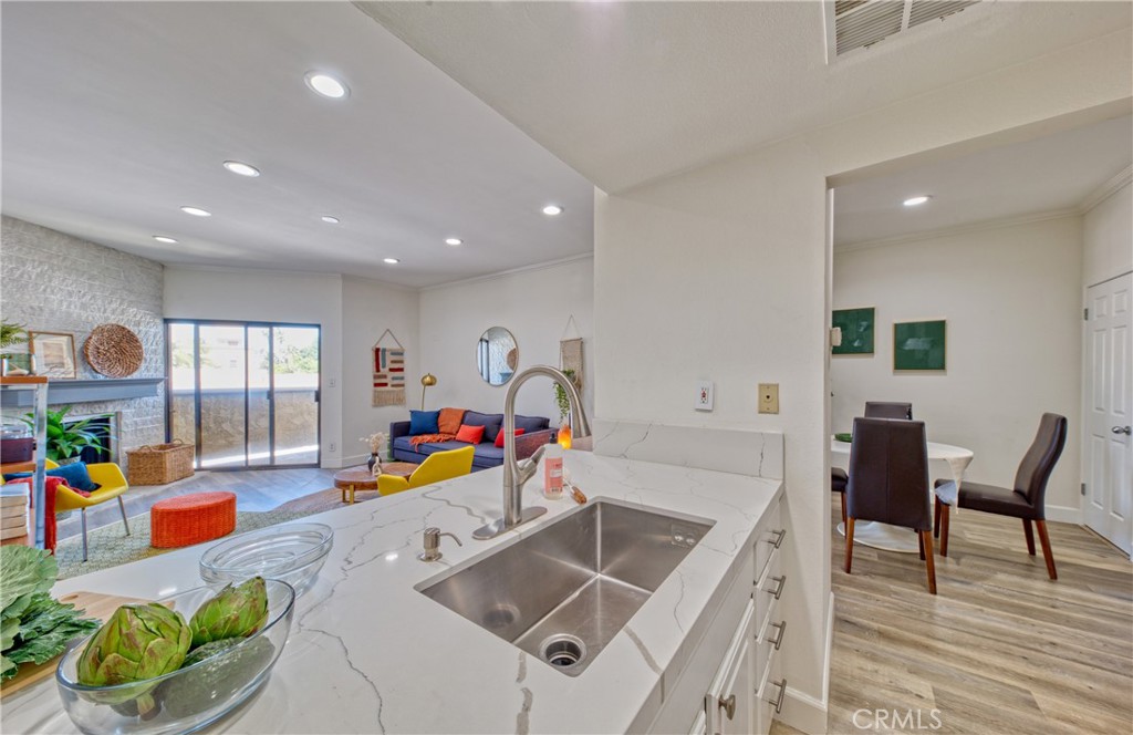 1665 Federal Avenue, Unit 302 Los Angeles, CA 90025 - Photo 15 of 31 a kitchen with stainless steel appliances granite countertop a sink and dishwasher