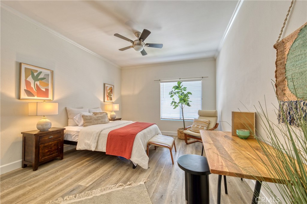 1665 Federal Avenue, Unit 302 Los Angeles, CA 90025 - Photo 20 of 31 a bedroom with a bed and wooden floor