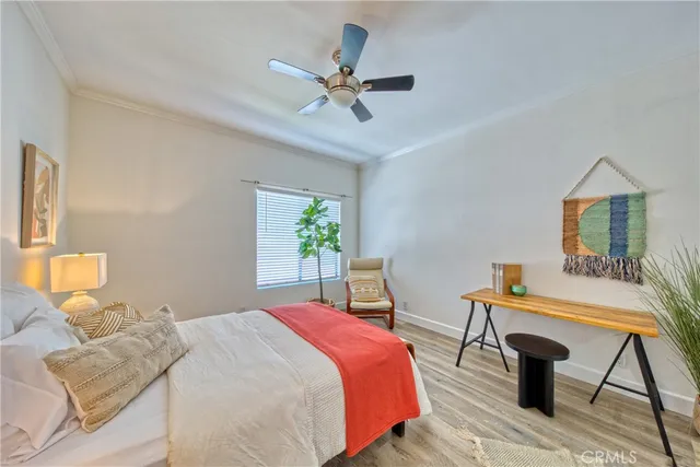 a bedroom with a bed and a table