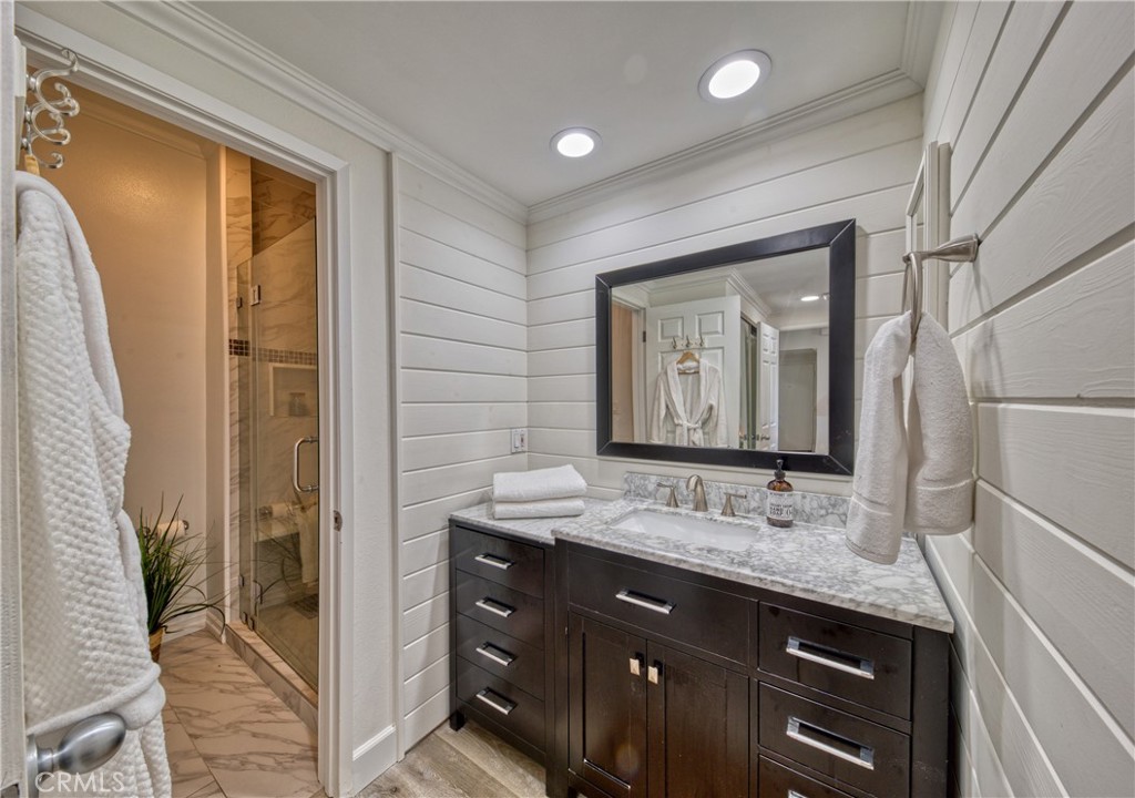 1665 Federal Avenue, Unit 302 Los Angeles, CA 90025 - Photo 24 of 31 a bathroom with a granite countertop sink mirror and double