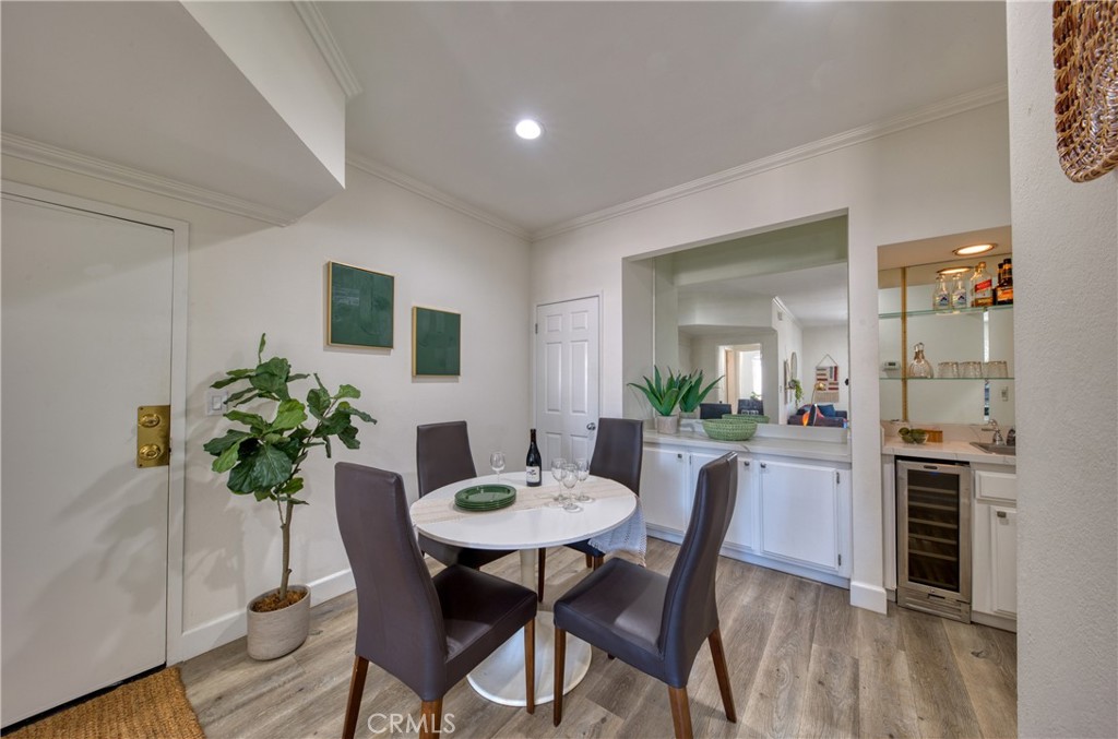 1665 Federal Avenue, Unit 302 Los Angeles, CA 90025 - Photo 8 of 31 a view of a dining room with furniture and wooden floor